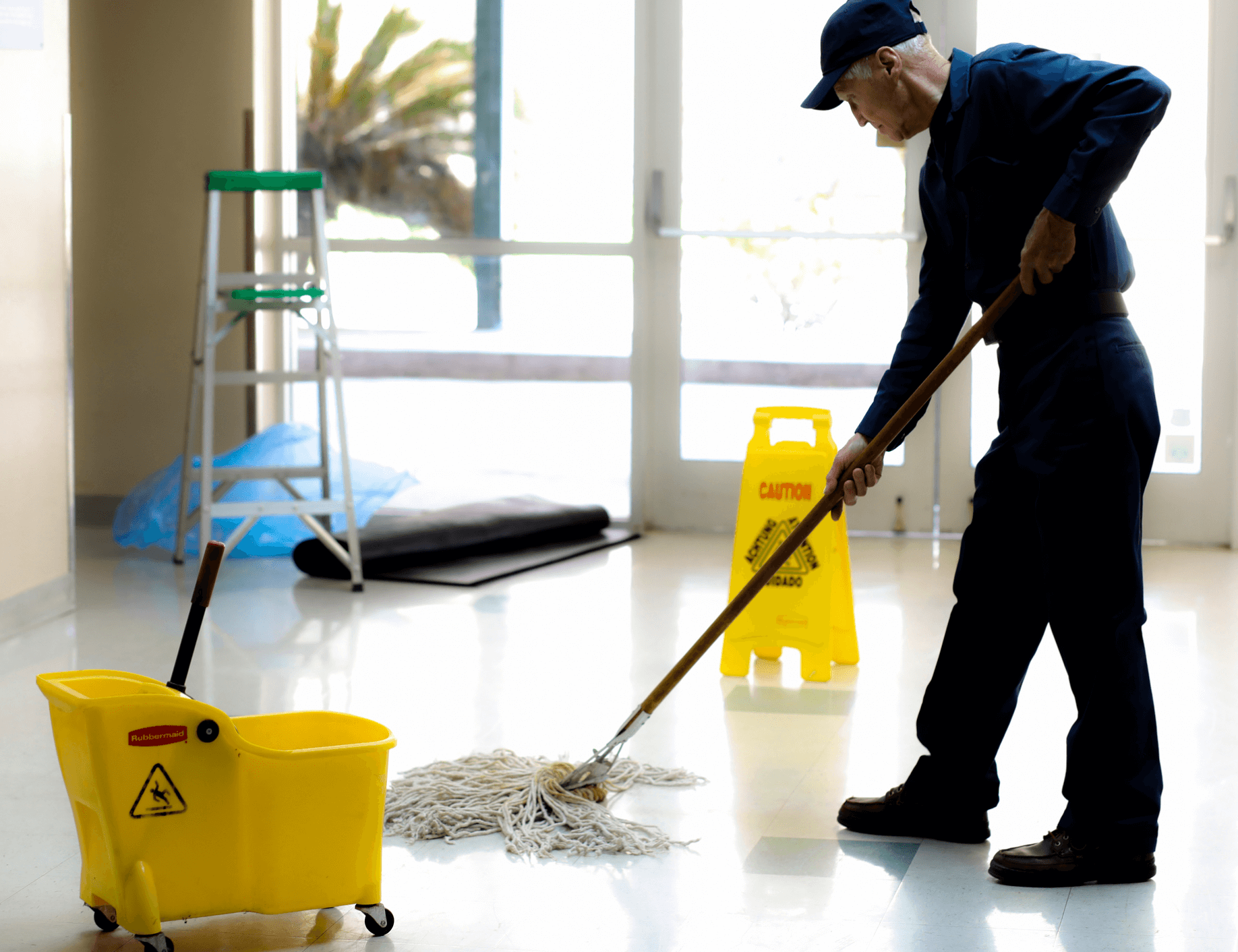 Man mopping floor