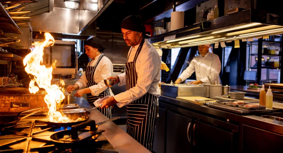 Chefs cooking in a commercial kitchen